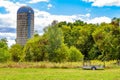 Stave Grain Silo by a Field with a Trailer Royalty Free Stock Photo