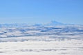 Elbrus Mount winter landscape over clouds