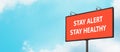 Stay Alert Stay Healthy warning sign on blue sky background. Large billboard with the message text