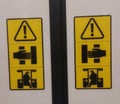 Stay clear of mower blade while engine running sticker in yellow colour on train door,warning board