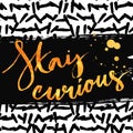 Stay curious. Golden calligraphy with ink drops