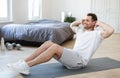 Man Exercising Doing Abs Sitting On Mat Training At Home Royalty Free Stock Photo