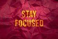 Stay focus in gold texture on crumpled red paper background,business concept Royalty Free Stock Photo