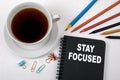 STAY FOCUSED concept. Black notebook and office supplies Royalty Free Stock Photo
