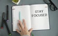 STAY FOCUSED man hand notebook and other Royalty Free Stock Photo