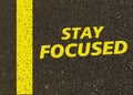 Stay focused written on the road.