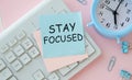 Stay Focused sticky note pasted on the keyboard Royalty Free Stock Photo