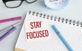 STAY FOCUSED text on notebook and other Royalty Free Stock Photo