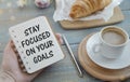 stay focused on your goals text on notebook. Royalty Free Stock Photo