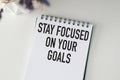 stay focused on your goals text on notebook. Royalty Free Stock Photo