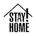 Stay home! black grunge ink stamping text slogan over white background