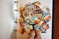 Magnifying glass with a bunch of postage stamps.