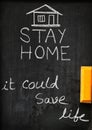 `Stay home it could save life` concept written on blackboard. Royalty Free Stock Photo