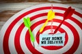 STAY HOME WE DELIVER. Red target with darts Royalty Free Stock Photo