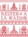 Stay Home in French Rester a la maison Nordic style inspired cross stitched sign with  Scandinavian Village elements Village Royalty Free Stock Photo