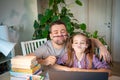 Funny daddy helps daughter with distance learning