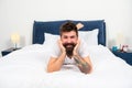 Stay home. Happy hipster feel safe at home. Bearded man relax in bed. Rest and relaxation. Leisure and lounge. Home