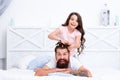 Stay home and have fun. Family leisure concept. Girl making hairdo for dad. Quarantine with children. Happy family Royalty Free Stock Photo