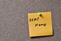 Information messages written on yellow paper and posted to a cork board Royalty Free Stock Photo