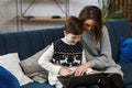 Stay home. Portrait of smiling mother and son using laptop for a online meeting, video call, video conference with Royalty Free Stock Photo