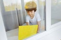 Stay at home quarantine coronavirus pandemic prevention. Sad child both in protective medical masks near windows and looks out Royalty Free Stock Photo