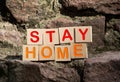 Stay at home stay safe message on wooden dices. Coronavirus COVID-19 outbreak advice Royalty Free Stock Photo