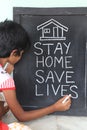 `Stay home save lives` concept written on blackboard. Royalty Free Stock Photo