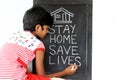 `Stay home save lives` concept written on blackboard. Royalty Free Stock Photo