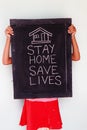 `Stay home save lives` concept written on blackboard. Royalty Free Stock Photo