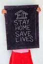 `Stay home save lives` concept written on blackboard. Royalty Free Stock Photo