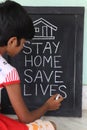 `Stay home save lives` concept written on blackboard. Royalty Free Stock Photo