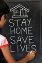 `Stay home save lives` concept written on blackboard. Royalty Free Stock Photo