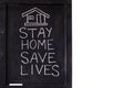 `Stay home save lives` concept written on blackboard. Royalty Free Stock Photo