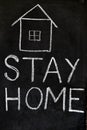 `Stay home`  concept written on blackboard. Royalty Free Stock Photo