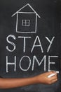 `Stay home`  concept written on blackboard. Royalty Free Stock Photo