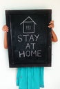 Stay at home concept written on blackboard. Royalty Free Stock Photo