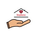 Stay at home slogan with hand, Heart medical and house inside. Protection campaign or measure from coronavirus COVID-19 Royalty Free Stock Photo