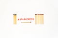 Stay at Home. Social distancing concept as stayathome. Matchsticks burn, one piece prevents the fire from spreading. Concept how