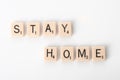 Stay Home spelled with tiles