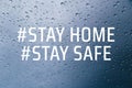 Stay home stay safe concept. Stay at home social media campaign for coronavirus COVID-19 prevention. Close up of rain drops on the Royalty Free Stock Photo