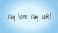 Stay home stay safe text words written in blue paper background