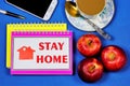 Stay at home-the text is written on a Notepad. Backed up by personal example. Convenient work from home, Internet activity on the