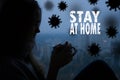 Stay at home virus quarantine background. Coronavirus backdrop with lettering, silhouette of young beautiful woman Royalty Free Stock Photo