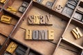 Stay home in wooden typeset letters