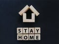 Stay home wording on wood block concept Royalty Free Stock Photo