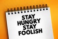 Stay Hungry Stay Foolish text on notepad, concept background Royalty Free Stock Photo