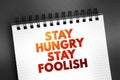 Stay Hungry Stay Foolish text on notepad, concept background Royalty Free Stock Photo