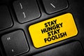 Stay Hungry Stay Foolish text quote button on keyboard, concept background Royalty Free Stock Photo