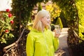 Stay hydrated. Resort with mineral water sources. Enjoy every sip of crystal clear water in blooming garden. Girl drink Royalty Free Stock Photo