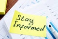 Stay Informed memo on the pile of business papers Royalty Free Stock Photo